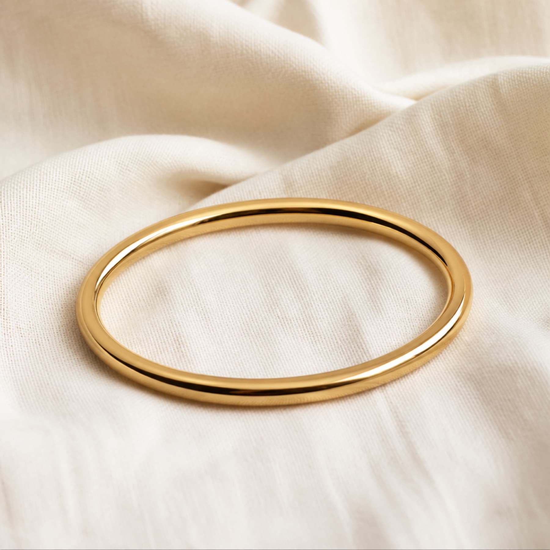 The Quiet Bangle gold-tone bangles